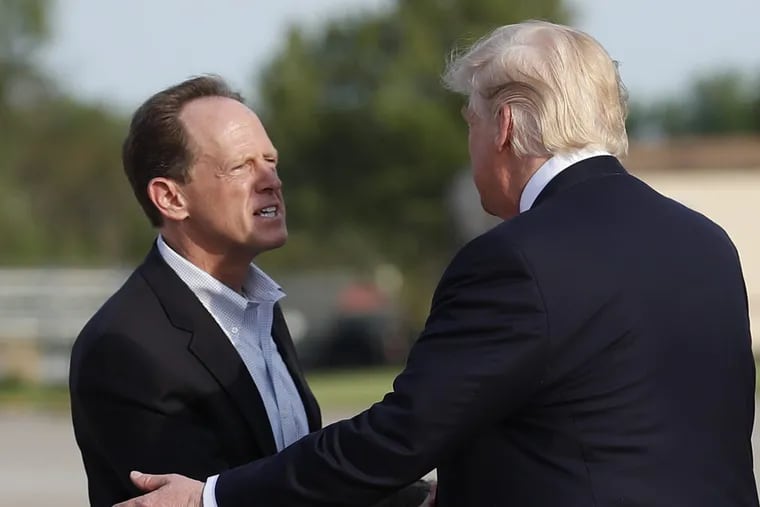 Sen. Pat Toomey greeted President Trump upon his arrival in Harrisburg last year.