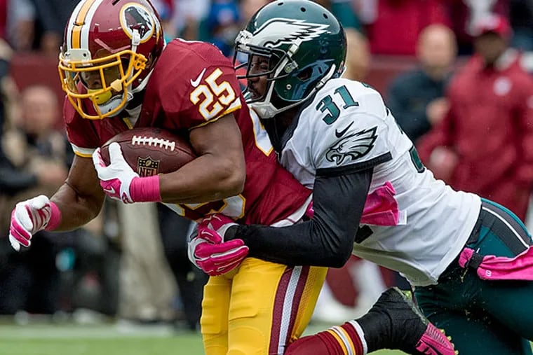 Washington running back Chris Thompson is brought down by Eagles
cornerback Bryon Maxwell.