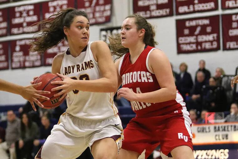 Gloucester Catholic's Mary Gedaka, left, is defended by Rancocas Valley's Katie McShea during a game Friday, February 12, 2016 ( KEVIN COOK / For The Inquirer )