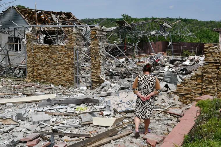 A woman walking next to a building damaged by an overnight missile strike in Sloviansk, Ukraine, on Wednesday.