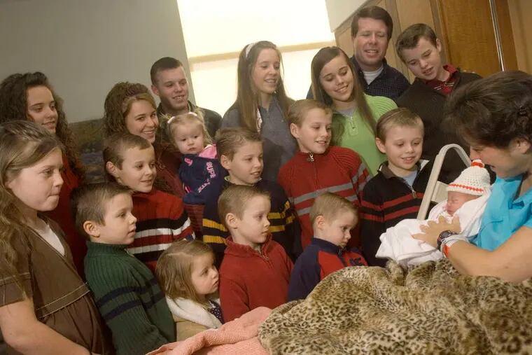 ASSOCIATED PRESS Michelle Duggar holds daughter Jordyn-Grace Mikaya, child No. 18 in the reality-TV family's lineup.