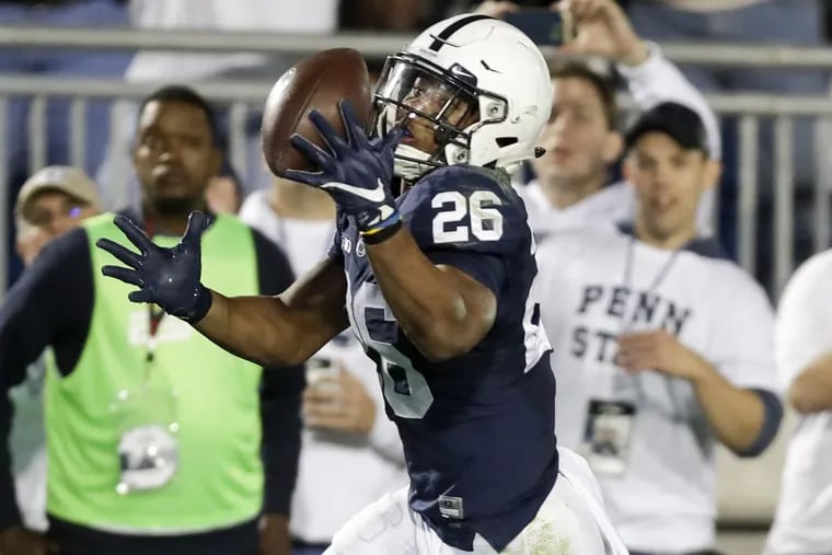 Penn State running back Saquon Barkley catches the football for a 42-yard touchdown against Michigan on Saturday.