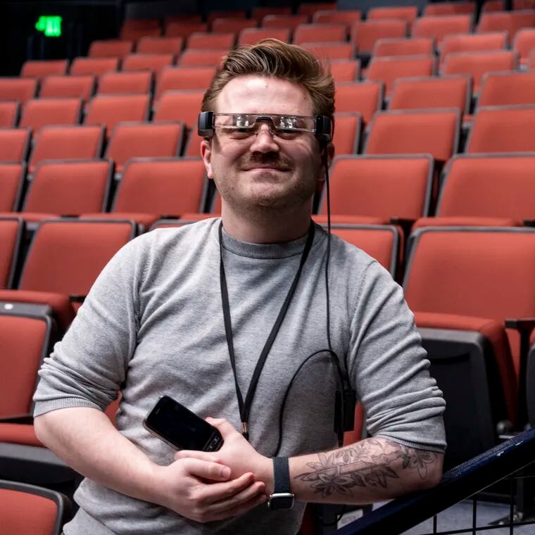 Tanner Richardett, audience services manager at the Arden Theatre, Tuesday, Feb. 13, 2024, demonstrates the smart caption glasses they offer to deaf and hard-of-hearing audiences.