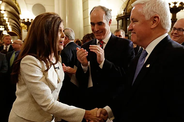 Gov. Corbett (right) and U.S. Sen. Bob Casey greeted Kathleen Kane before she took her oath of office as state attorney general this month. MATT ROURKE / Associated Press