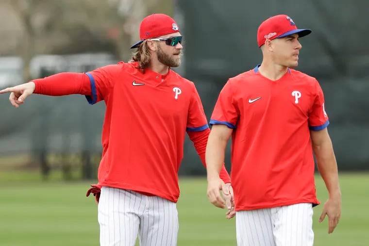 Bryce Harper and J.T. Realmuto (right) were two of the Phillies' biggest acquisitions last offseason, and they have since become good friends.