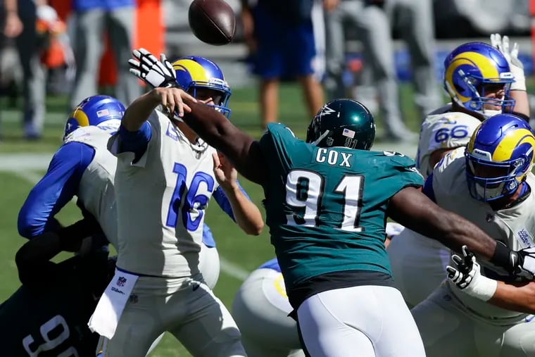 Defensive tackle Fletcher Cox pressures Rams quarterback Jared Goff during the second quarter of the Eagles' 37-19 loss on Sunday.