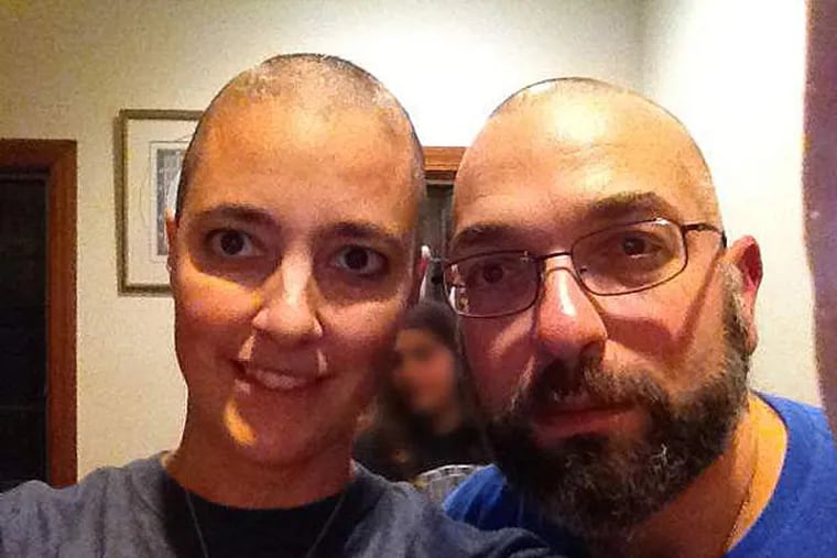 Amy Reed and Hooman Noorchashm after she began chemotherapy.  What Reed thought was a routine hysterectomy in Boston ended up spreading cancer. Reed and her husband, Noorchashm, both doctors, are campaigning against the procedure she had, known as morcellation.