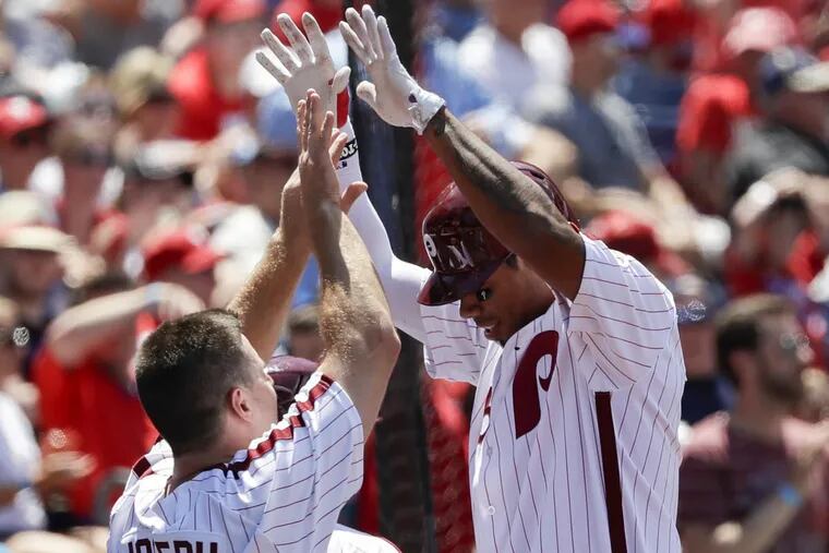 Phillies’ Nick Williams (right) celebrates his first major-league home run with  Tommy Joseph.