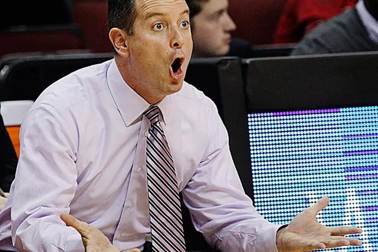 Rutgers on Thursday said it has suspended coach Mike Rice for three games without pay and fined him $50,000 for what it called "inappropriate behavior and language" that violated department policy. (Mel Evans/AP file photo)
