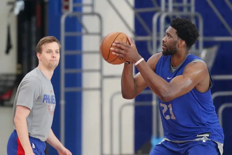 Joel Embiid shoots during practice at the Sixers Training Complex in Camden on Thursday.