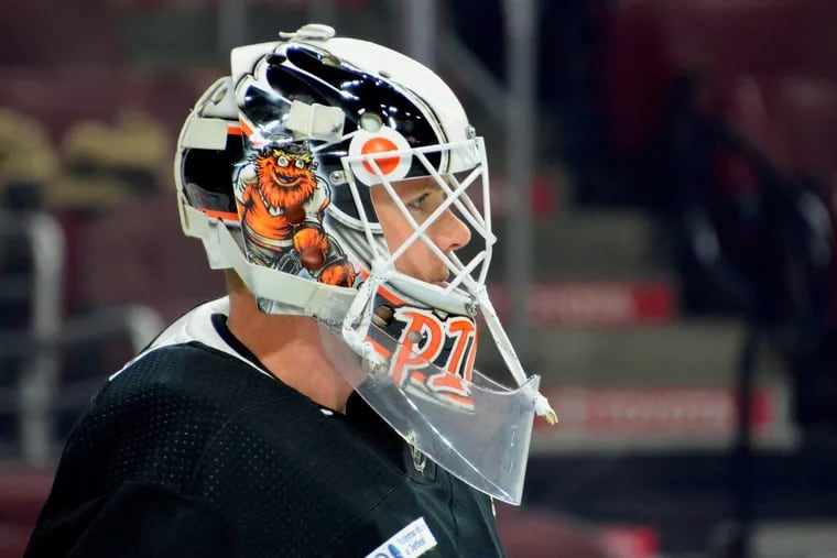 Flyers goalie Cal Pickard is shown Tuesday wearing his new helmet, which features the team's mascot, Gritty.