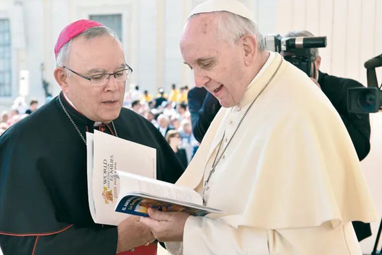 FILE: Pope Francis (right) and Archbishop Charles Chaput at an audience in St. Peter's Square on March 26, 2014.