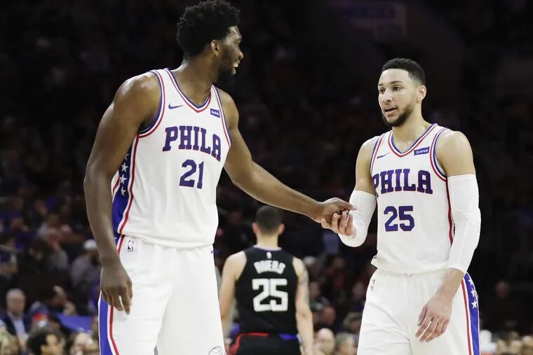 Sixers guard Ben Simmons with teammate center Joel Embiid against the Los Angeles Clippers on Saturday, February 10, 2018 in Philadelphia.