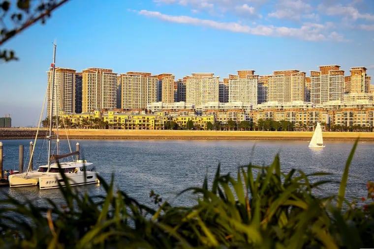 A section of the Evergrande mega-project complexes is seen on Haihua Islands in Danzhou in south China's Hainan province on Nov. 19, 2019. The troubled Chinese real estate developer that is struggling with $310 billion in debt announced on Jan 4, 2022 it has been ordered to demolish a 39-building resort complex in the Southern province of Hainan in a new blow to its finances. The company said the order would affect only a portion of the Ocean Flower Island project.  (Chinatopix Via AP)
