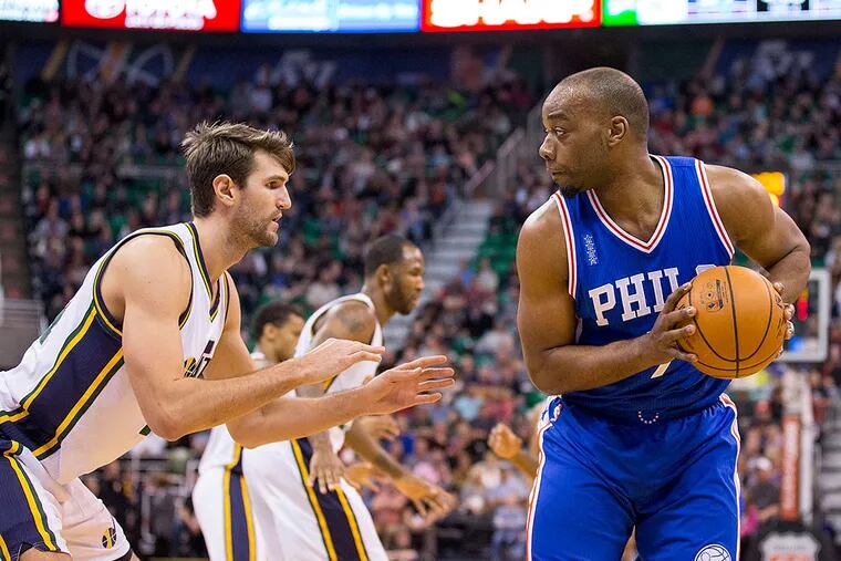 Utah Jazz center Jeff Withey (24) defends Philadelphia 76ers forward Carl Landry (7) during the second half at Vivint Smart Home Arena.