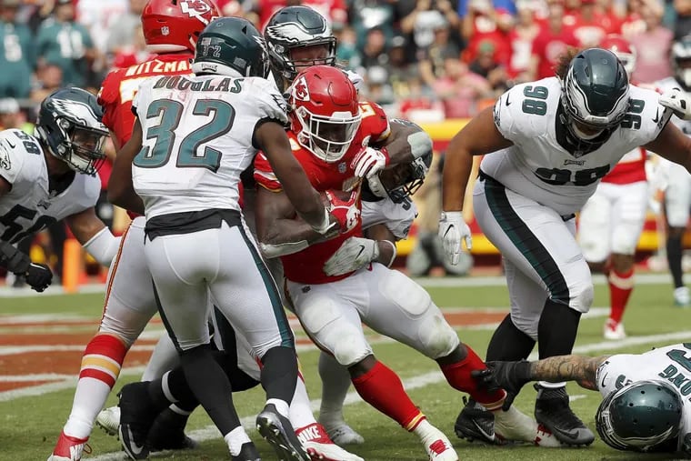 Chiefs’ Kareem Hunt carries a host of Eagles’ defenders into the end zone for a fourth quarter touchdown.