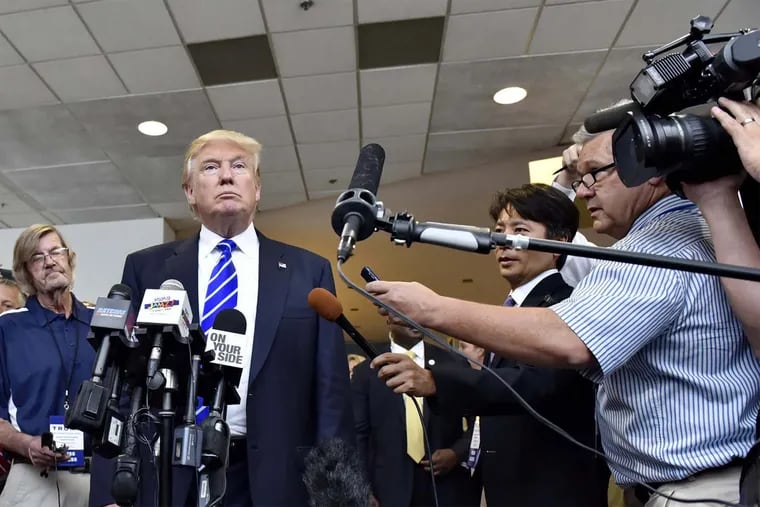Republican presidential candidate Donald Trump speaks to reporters in South Carolina