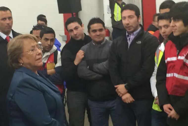 President Michelle Bachelet is joined at the Port of Wilmington by several Chilean laborers who work there. She will also visit Philadelphia on her trade mission.