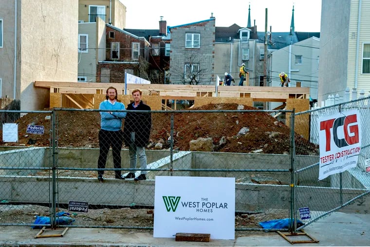 Developers Max (left) and Zachary Frankel (right) on the site of where they plan to build workforce housing units in Philadelphia's West Poplar neighborhood. The lots were purchased from the city's Land Bank.