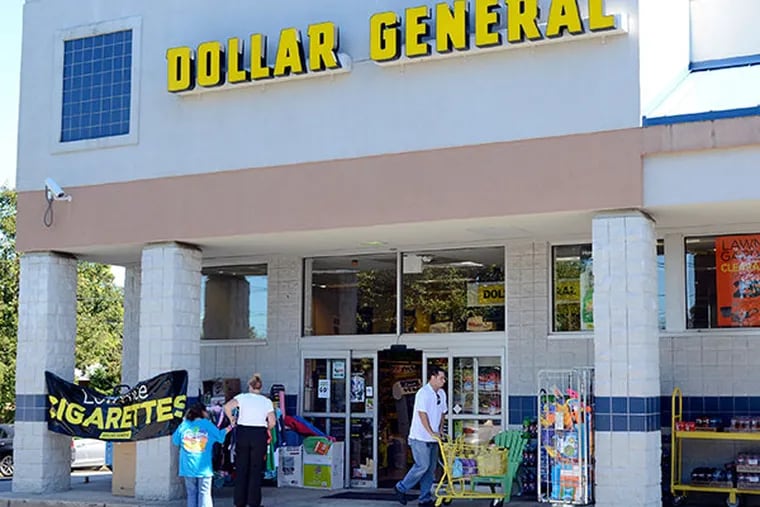 A regular shopper at the 75-year old company, Milton Ekonomou (with cart), 33, of Pennsauken leaves the Dollar General store on Kings Highway in Cherry Hill, on September 24, 2013. Economists say as long as Dollar General gives the “impression” of cheaper prices, the stores will flourish in both good and bad economic times. This year alone, Dollar General will open 650 new stores nationwide. ( TOM GRALISH / Staff Photographer )
