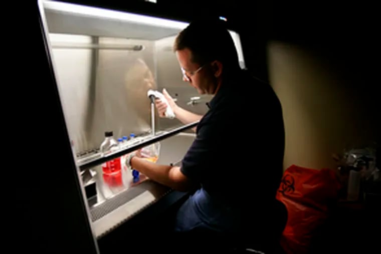 Wes Rose at work in his laboratory at Arcadia University. The assistant biology professor says blind alleys are &quot;just part of the scientific process.&quot;