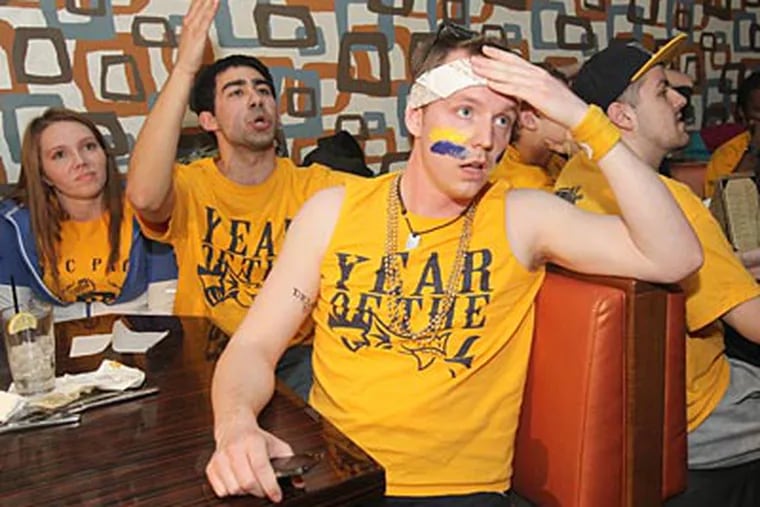 Drexel fans react after learning that Drexel was not selected to the 2012 NCAA Tournament. (Charles Fox/Staff Photographer)