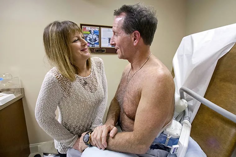 Don Chalpin is still undergoing his procedure when his wife Millie comes in to show the results of her facial procedure by Dr. Steven L. Davis at his office in Cherry Hill on January 22, 2014.  ( DAVID M WARREN / Staff Photographer )