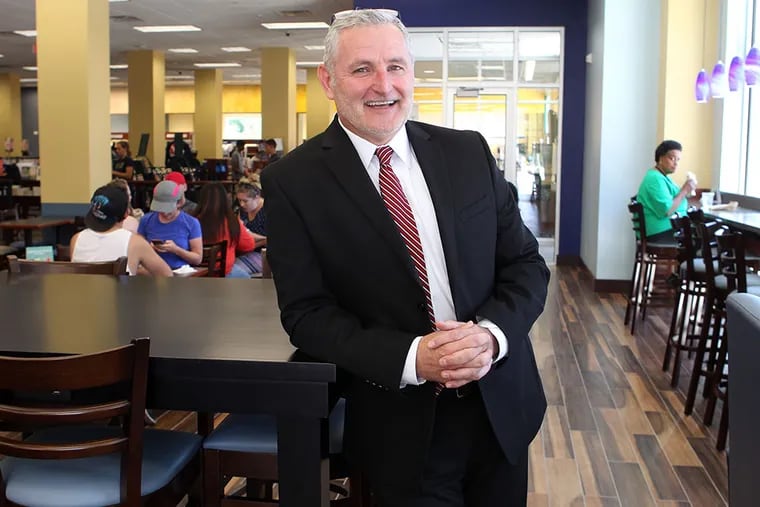 Curt Heuring, vice president for administration for the College of New Jersey, shows off the cafe area of the new Barnes & Noble bookstore that recently opened as part of Campus Town in Ewing, N.J. (BEVERLY SCHAEFER/For The Inquirer)