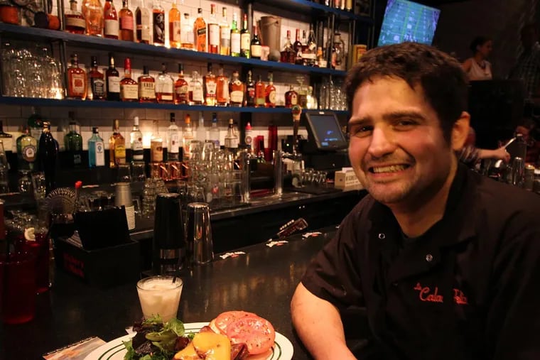 Chef Matthew Savastano with a fried bologna sandwich at Beast & Ale, 4161 Main St.