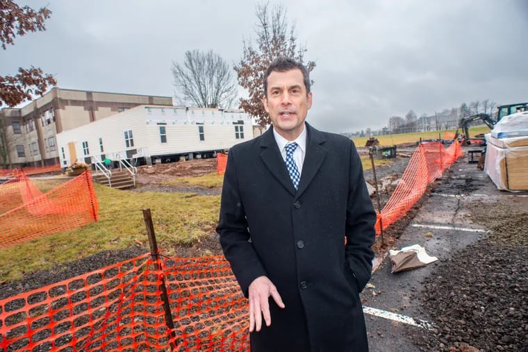 Steve Skrocki, chief financial officer of the North Penn School District, stands in front of the under-construction health center by Penndale Middle School in Lansdale. The center is slated to open in February for district employees and their family members.