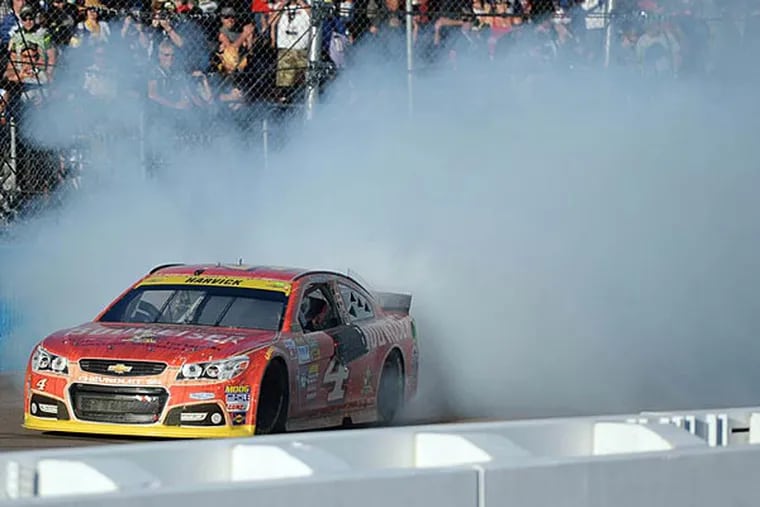 NASCAR Sprint Cup Series driver Kevin Harvick (4) burns out after winning the Quicken Loans Race For Heroes 500 at Phoenix International Raceway. (Joe Camporeale/USA Today)