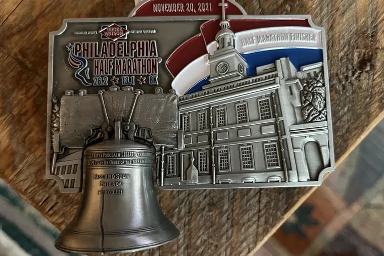 A photo of the medal given to runners in the Philadelphia Half Marathon for 2021.
