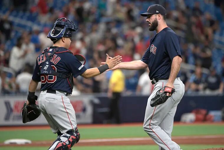 The Phillies acquired reliever Brandon Workman (right) on Friday night in a four-player trade with the Boston Red Sox.