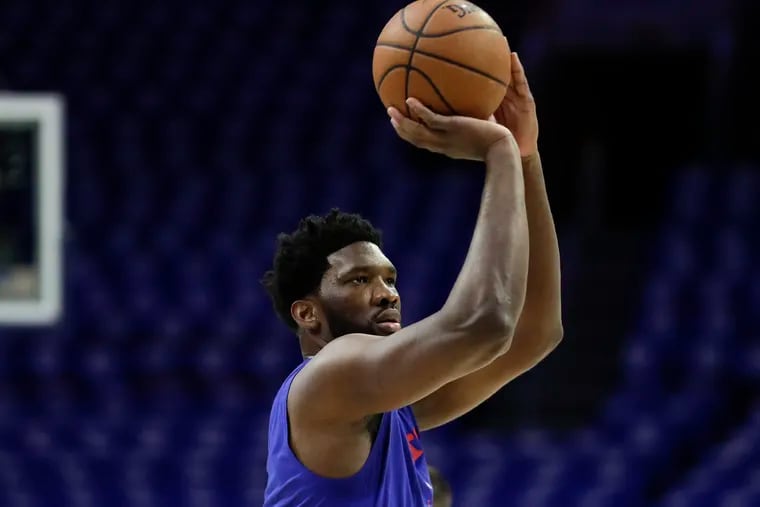 Sixers center Joel Embiid shoots the basketball warming-up before the Sixers play the Brooklyn Nets in game one of the Eastern Conference playoffs on Saturday, April 13, 2019 in Philadelphia.