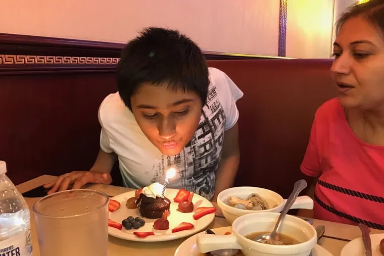 Areen Chakrabarti, shown here celebrating his 14th birthday with his mother, Rumpa Banerjee, was diagnosed as brain dead three months ago, but he remains on a ventilator.