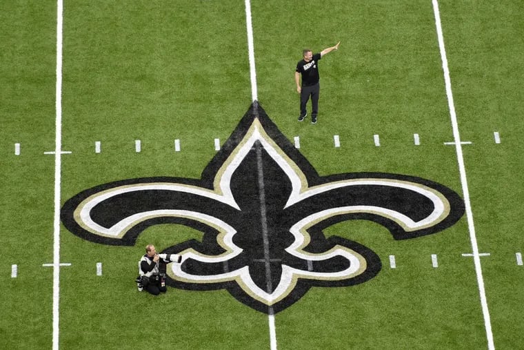 The New Orleans Saints logo is seen on the field of the Mercedes-Benz Superdome in New Orleans.