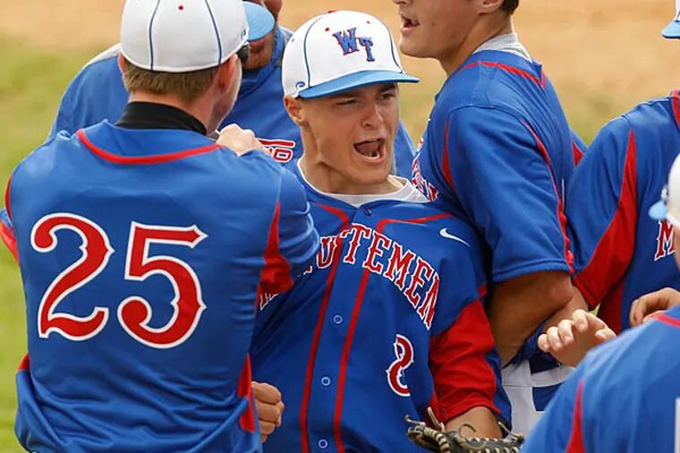 Washington Township's CF Nick Hartz is congratulated by teammates
after a spectacular catch in first inning in first round of Diamond
Classic at Maple Shade HS,NJ on Saturday, May 11,2013. (Ron Cortes/Staff Photographer)