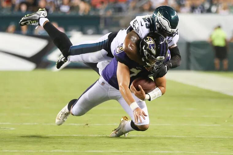 Eagles safety Rodney McLeod had three tackles in 14 snaps on Thursday, including this stop of Baltimore quarterback Trace McSorley.