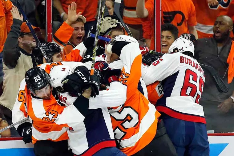 The Flyers and Washington Capitals fight in the third period of Game 3 of the Eastern Conference quarterfinals on Monday, April 18, 2016 in Philadelphia.