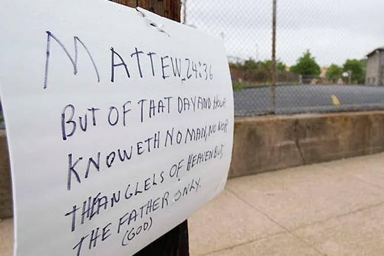 DAVID MAIALETTI / STAFF PHOTOGRAPHER A handmade sign, quoting a verse from the Gospel of Matthew, hangs near the Delaware County union hall used for eBible meetings.
