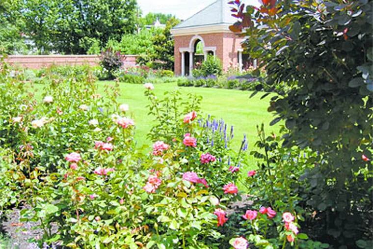One of the brick pavilions at the back of the rose garden at Pennsylvania Governor Tom Ridge's residence. Many of the roses are low-maintenance varieties such as the Knockout series. (Mackenzie Carpenter / Post-Gazette )