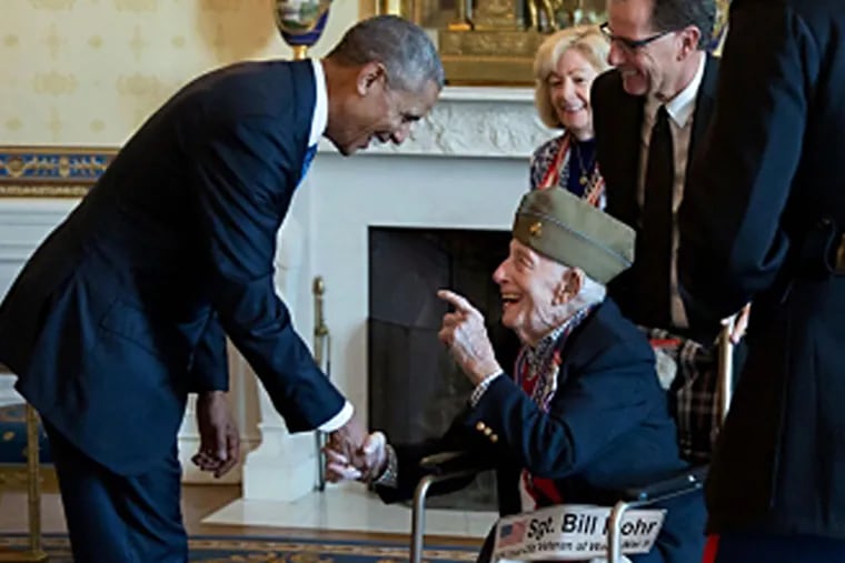 President Barack Obama greets Sgt. Bill Mohr, a 108-year-old veteran of World War II, during a Veterans Day breakfast receiving line in the Blue Room of the White House, Nov. 11, 2016.