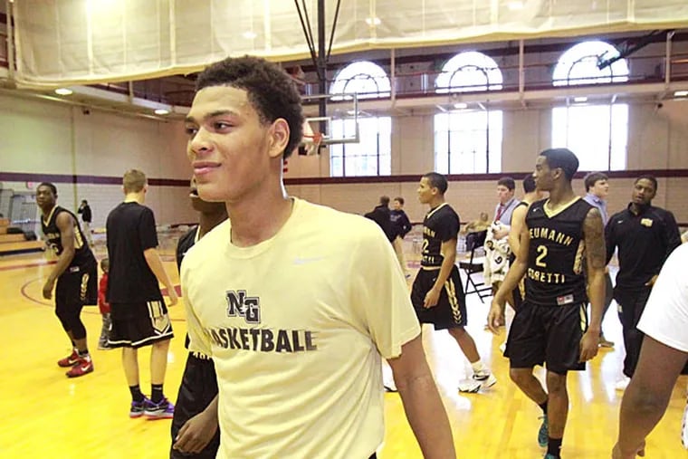 Quade Green, center, of Neumann-Goretti walks off the court after
their 70-44 victory over St. Joesph's Prep at Kelly Fieldhouse on Feb.
4, 2015. (Charles Fox/Staff Photographer)