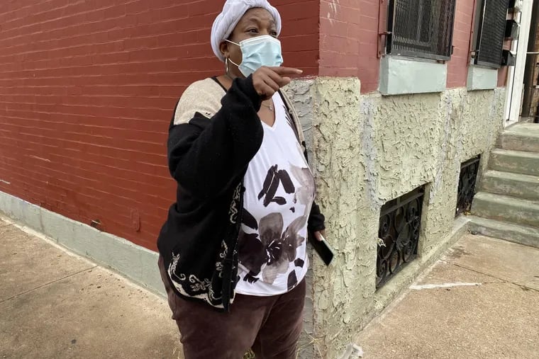 Gwendolyn Toler, grandmother of 18-year-old Joseph Lighty, speaks Wednesday at 13th and Carpenter Streets in South Philadelphia, the day after her grandson and another teenager were shot at a basketball court on the 1200 block of Carpenter Street.