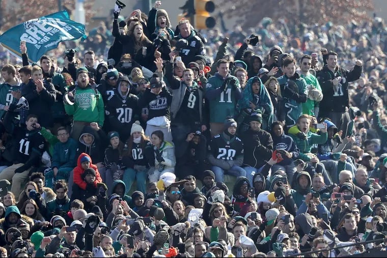 Eagles fans cheer for the Super Bowl champs as the parade reaches its conclusion near the Art Museum. Thousands turned out on a brisk, sunny day. DAVID MAIALETTI / Staff Photographer