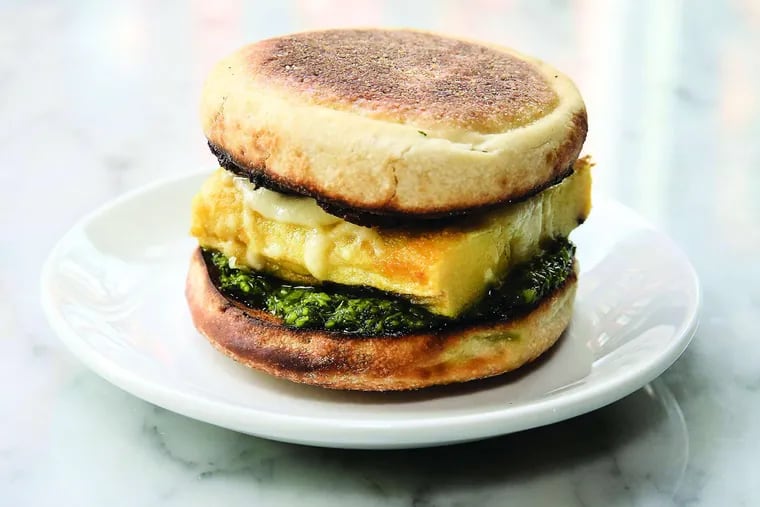Res Ipsa's breakfast sandwich: a square frittata sandwiched by a house-baked English muffin with Asiago, a cardamom-scented fennel sausage patty, and a salsa verde of parsley, lemon, and long hots.