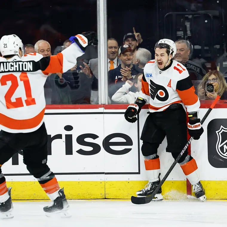 Flyers right wing Travis Konecny celebrates after scoring a second-period short-handed goal with teammate center Scott Laughton against the New Jersey Devils on Saturday.