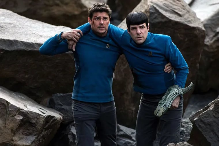 Karl Urban portrays Bones (left) and Zachary Quinto portrays Spock in a scene from "Star Trek Beyond."