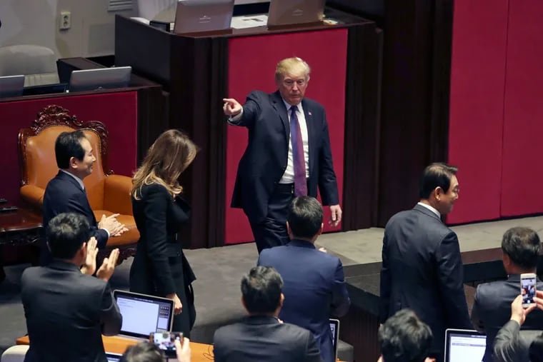 President Trump gestures at the South Korean National Assembly on Wednesday in Seoul, South Korea. Trump is on a five country trip through Asia traveling to Japan, South Korea, China, Vietnam and the Philippines.
