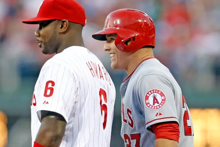 Longtime Phillies fan Mike Trout chats with Ryan Howard after singling in Angels’ 4-3 win.